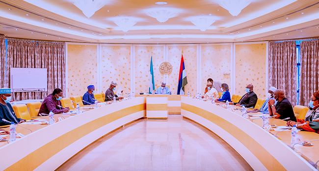 President Buhari receives a briefing from Chairman and Members of the Independent National Electoral Commission (INEC) in State House on June 1, 2021. Bayo Omoboriowo/State House